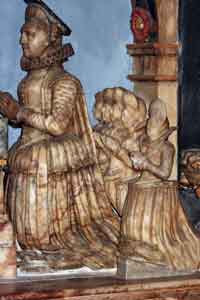 Kneeling figure of Martha suckling with 5 daughters behind her
