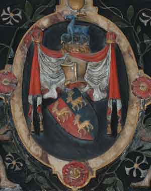 Crest of the Suckling family showing honeysuckle around  heraldic helmet