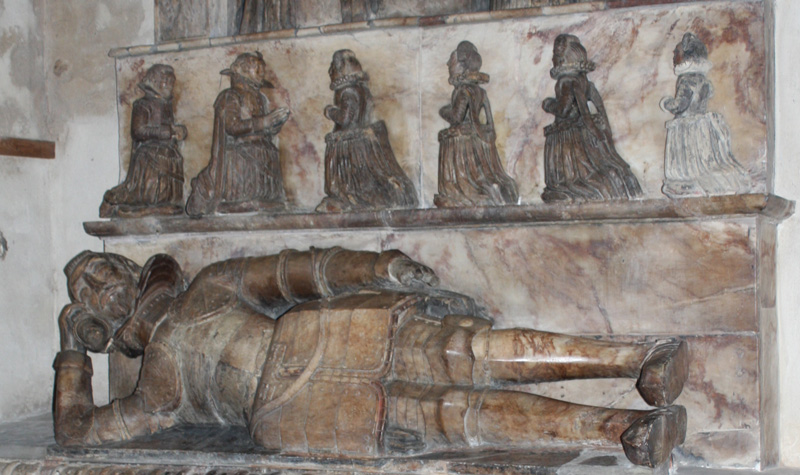 Thoma Pettus kneeling over prayer desk